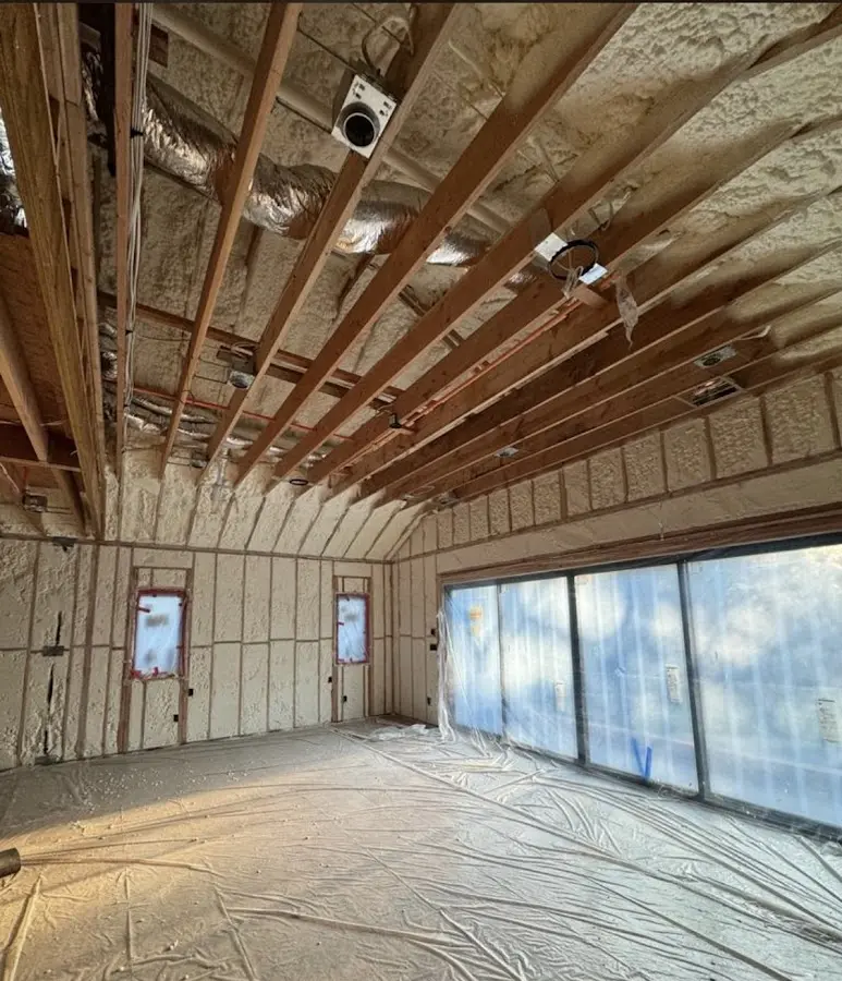 Interior walls and ceiling insulated with spray foam during new construction in Stockton